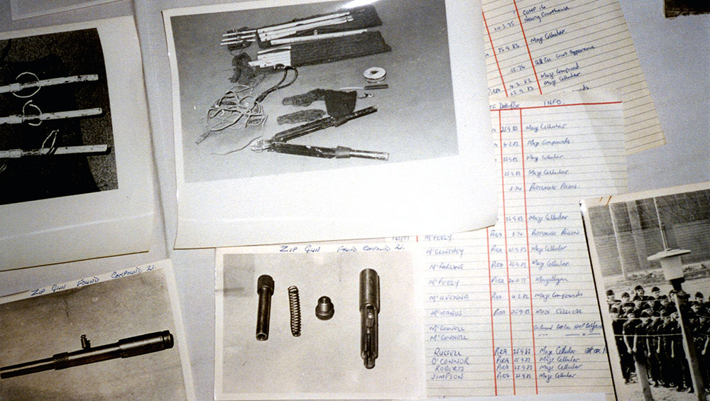 Still from the film Billy's Museum showing prison related photographs and written material